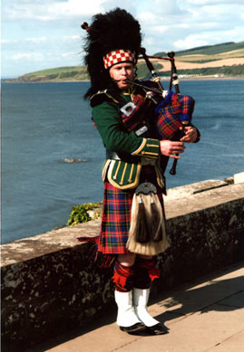 Bryce the piper at Culzean Castle playing on viewing platform.